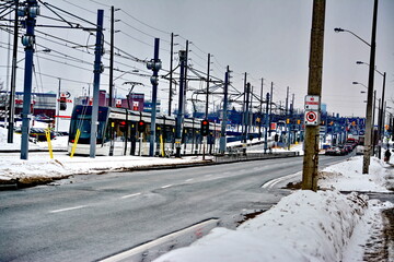 Naklejka premium Toronto, Ontario, Canada, February 6, 2026: A Metrolinx Eglinton Crosstown LRT test train makes its way along the transit line in Scarborough. This LRT line, after waiting for years to open, is now sc