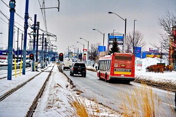 Naklejka premium Toronto, Ontario, Canada, February 6, 2026: A Metrolinx Eglinton Crosstown LRT test train makes its way along the transit line in Scarborough. This LRT line, after waiting for years to open, is now sc