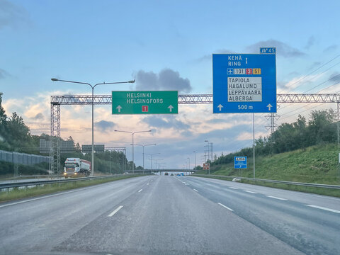 Highway Road Signs in Finland Directing to Helsinki and Ring I Interchange with Keha I Tapiola and Leppavaara Destinations at Twilight