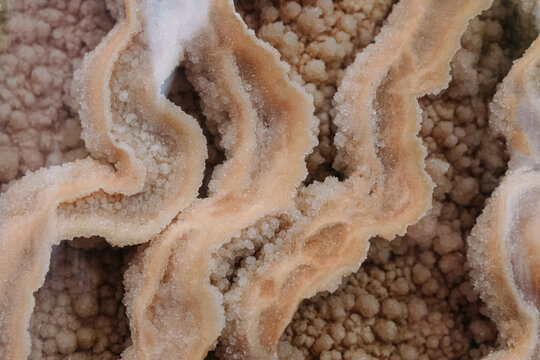 Calcite. Surface structure close-up. Naturally occurring form of calcium carbonate.