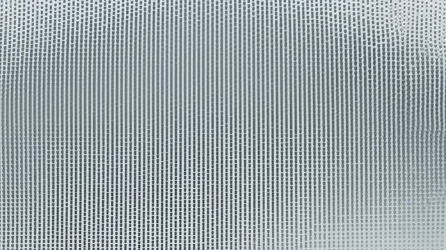 loop of a soft gray halftone dot grid gently flowing across a white background. Clean, neutral and professional motion background ideal for corporate, medical and tech presentations
