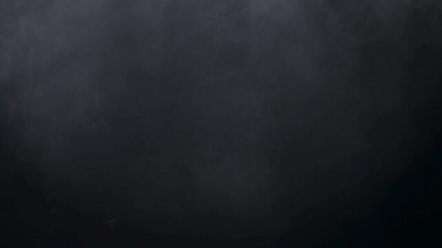 Abstract dark smoke black backgrounds grey smoky cloud movement with fine particles floating and swirling gently in an atmospheric mysterious and ethereal motion on transparent background