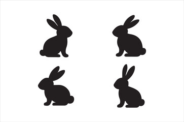 Fototapeta premium Four black silhouettes of rabbits in various seated and alert positions