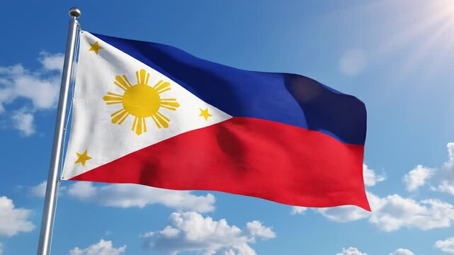 Vibrant Philippine flag flying on pole with sunny blue sky