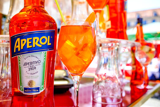 Munich, Germany - June 6: typical aperol bottle and glasses at a bar in Munich on June 6, 2025