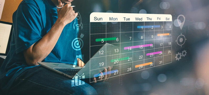 Strategic Business Planning and Project Management Concept, Professional Working on Laptop with Digital Calendar and Goal Icons Overlay.