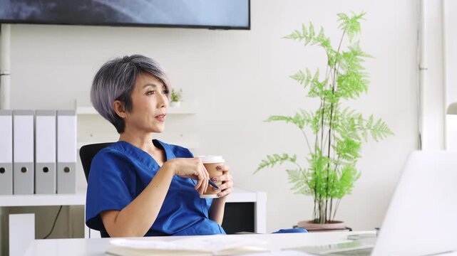 Medical Doctor, woman, coffee  with thinking, vision or ideas for healthcare career. mature doctor, in hospital office drink coffee and mindset on path, wellness or clinic job.
