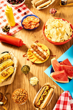 Backyard Barbecue Feast with Hot Dogs, Snacks, and Fresh Watermelon