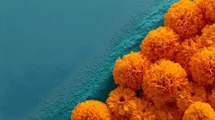 Orange Marigold flowers on blue rangoli powder. Traditional Indian decoration for Gudi Padwa and new year. Indian festival flower backdrop.