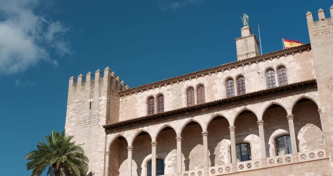 Beautiful architecture of Royal Palace of Almudaina and adjacent Palma Cathedral in Palma de Mallorca Spain on a sunny day.