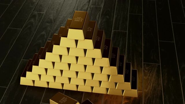 Golden bars stacked on a wooden floor