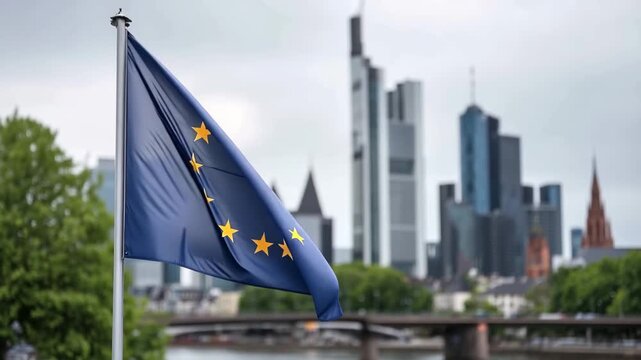 Flags of Europe waving in Frankfurt city backdrop