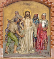 Fotobehang Jezus Christus Vienna - The relief of  Jesus clothes are taken away (part of Cross way) in the Herz Jesu church from begin of 20. cent. by Workroom from Munich.  © Renáta Sedmáková