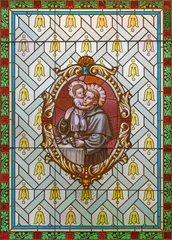 Fotobehang Jezus Christus Vienna - The  St. Anthony of Padua on the stained glass of church  Alserkirche  by Franz Gotzer from 20. cent.  © Renáta Sedmáková