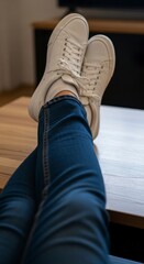 Person wearing blue jeans and sneakers.