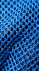Blue fabric texture with holes pattern.