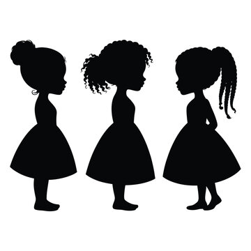 Three young girls stand in silhouette facing each other closely