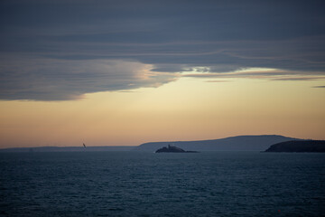 Obraz premium Godrevy Lighthouse at Twilight Viewed from St. Ives, Cornwall.