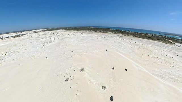 Wide Snow White Lancelin Sand Dunes Under Clear Blue Sky in the beauty of arid coastal terrain