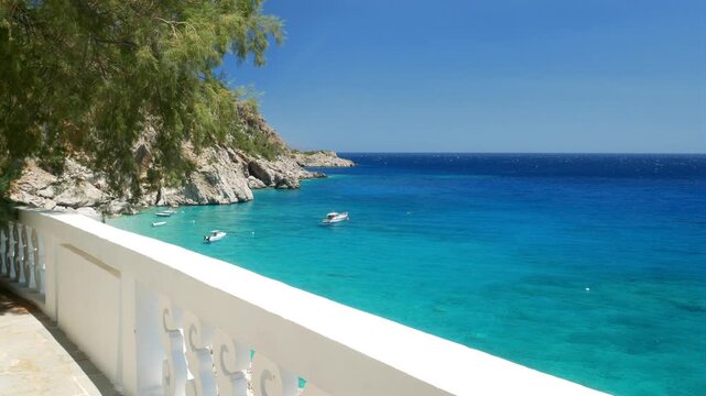 Breathtaking panoramic view of Kira Panagia beach with turquoise crystal clear waters and white terrace on Karpathos island, Greece