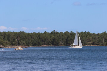 A sailing yacht is sailing on the Baltic Sea near the coast of Sweden.