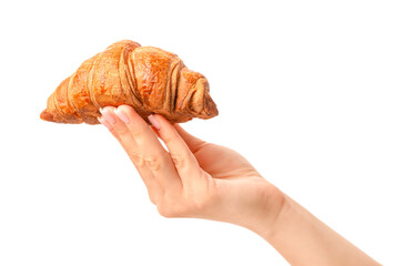 Fresh golden croissant balanced on fingers and held by female hand isolated on white background,...