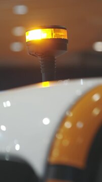 Special autotechnic on the roof of electrocar - yellow signal beacon