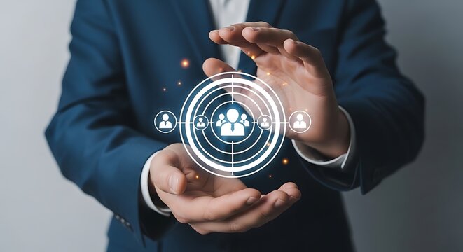 Businessman holding a glowing digital network of people icons, symbolizing human resources and talent acquisition