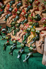 Cute figurines of frogs made of clay, handmade. Crafts Fair. Travel souvenir.