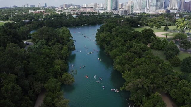 Aerial View of People Kayaking on Lady Bird Lake with Austin Texas Skyline