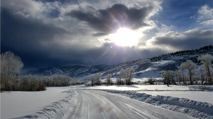 Snowy Mountain Landscape with Dramatic Sunlight
