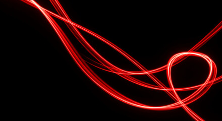 Abstract of red light streaks on black, creating dynamic patterns and a sense of motion, representative of speed, energy, or modern technology