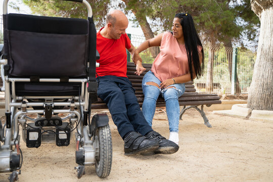 Inclusive companionship on an outdoor park bench