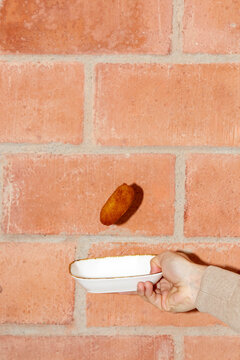Croqueta being caught in a dish