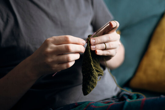 Knitting hobbyist crafting with passion at home