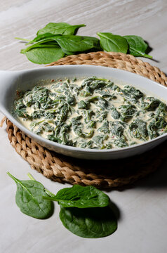 Creamed spinach in a white serving dish