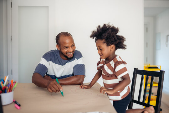 Father and daughter enjoying drawing time together