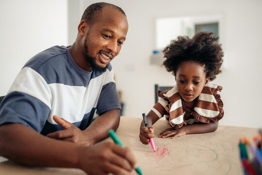 Father and daughter enjoying creative time together