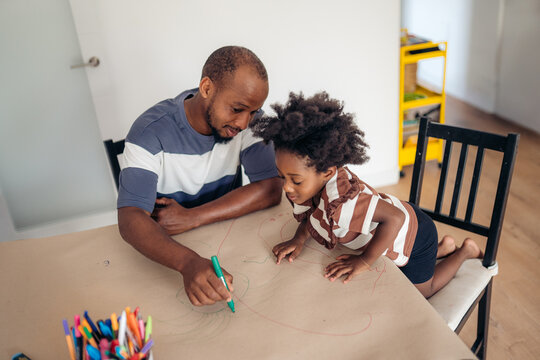Father and daughter enjoying creative drawing time