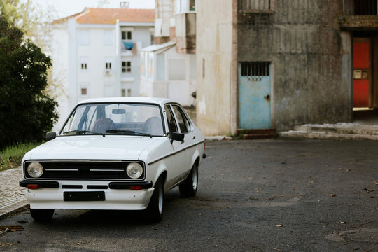 Classic white car parked in urban area