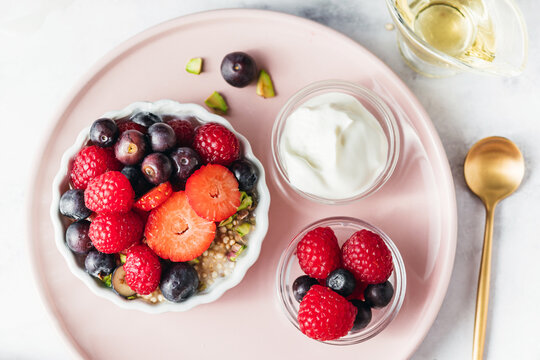 Greek Yogurt Bowl with Red Berries, Puffed Quinoa, and Pistachios