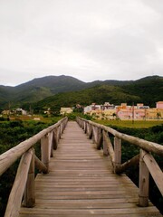 Obraz premium Wooden pier at Laranjeiras beach with turquoise water, Balneario Camboriu, Brazil.