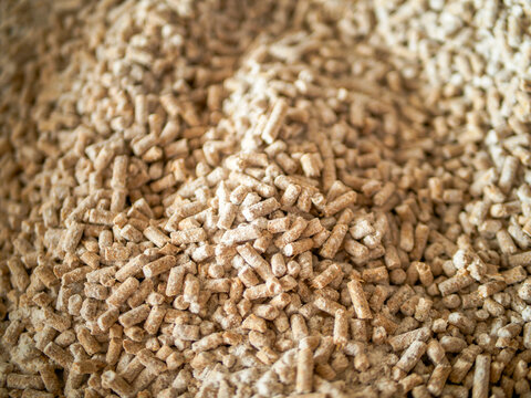 Detailed texture of pig feed. Animal food background used in pig farming and livestock production, ideal for agriculture, animal nutrition, and agribusiness concepts.
