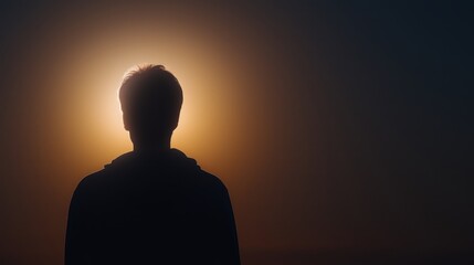 Cinematic portrait of a person standing in soft glowing backlight with a warm halo, expressing hope and inner stillness.