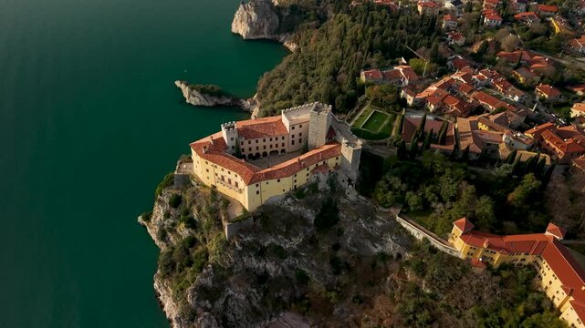 Duino Castle Top View: Aerial Movement Back and Tilt Down Revealing Medieval Fortress and Sea Cliffs, Adriatic Coast Perspective, Cinematic 4K Mediterranean Aesthetics File 2