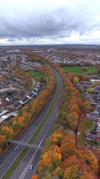 Aerial drone view of suburban neighborhood and road in autumn, Basingstoke England