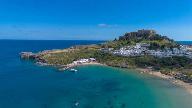 Rhodes, Greece. Lindos small whitewashed village and the Acropolis, scenery of Rhodos Island at Aegean Sea.