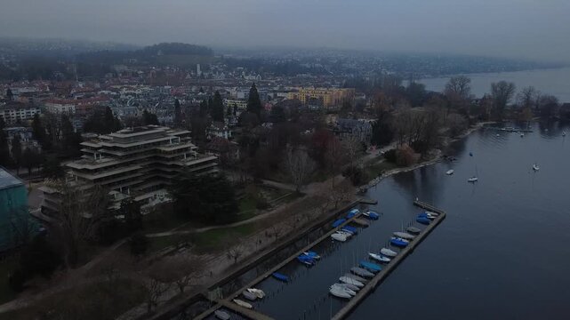 Aerial view of Zurich Lake and city skyline during a misty winter day, Switzerland.