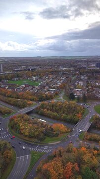 Aerial drone view of suburban neighborhood and road in autumn, Basingstoke England