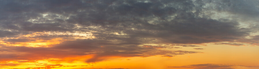 Fototapeta premium Panorama of Beautiful sunset sky with clouds